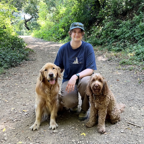 Marisa Piovarcsik, Walker, Pack Leader smiling on a path                  